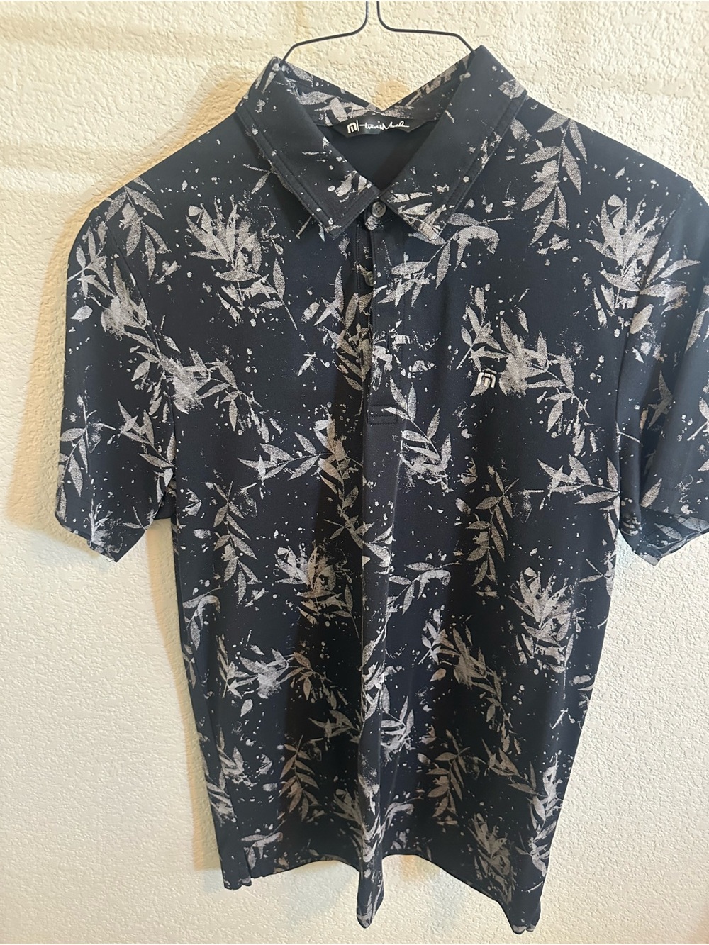 Travis Mathew Black Polo with Light Gray Botanical Print - Picture 2 of 4